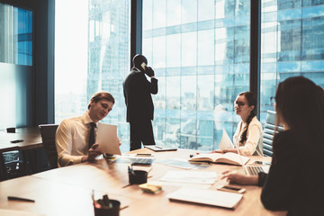 Communicating business people in office boardroom