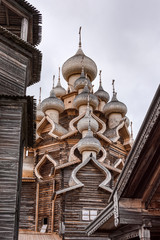 Russia, Republic of Karelia, Kizhi Island: Famous wooden onion domed Church of the Transfiguration on Kizhi Pogost, a historical site and Russian national open-air museum with cloudy sky - history.