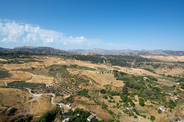 Fototapeta na wymiar Scenic viewpoint to valley and mountains from Ronda, small ancient white town in Andalusia, Spain