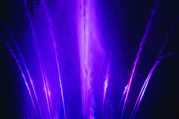 Ukraine. Kyiv - 05.06.2019 Amazing dancing fountain in the night illumination of rainbow color with colorful illuminations on the lake.