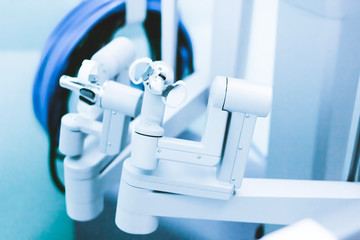 hands of a surgeon at a computer robot, joystick control. Medical robot. Robotic surgery, operating room.