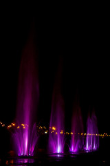 Ukraine. Kyiv - 05.06.2019 Amazing dancing fountain in the night illumination of rainbow color with colorful illuminations on the lake.