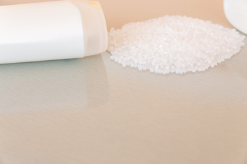 Close-up of plastic polymer granules and plastic bottle. Polymer pellets. polymer plastic. compound polymer. reuse plastic.