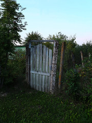 Сlosed entrance to the garden plot in the countryside in Russia