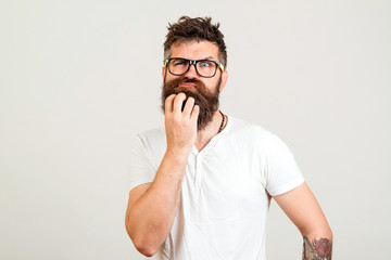 Bearded man doubting about new idea on white background. Bearded hipster guy thinking for new start...
