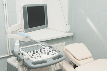 Ultrasound machine. Medical room with ultrasound diagnostic equipment. 