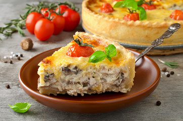 Freshly baked homemade pie quiche Lorraine on a wooden table