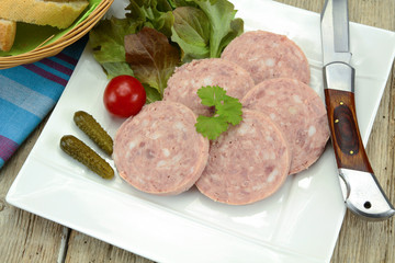 slices of garlic sausage on a plate