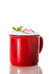 Peppermint coffee mocha decorated with candy canes for Christmas isolated on white background