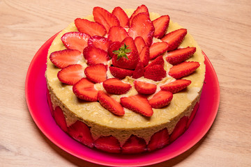 homemade strawberry cake in a red dish
