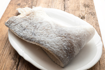 Slice of raw salted codfish