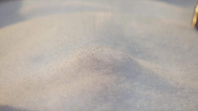Polypropylene granules closeup slowmotion, polypropylene drop. Plastic granules fall in slow motion
