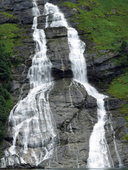 The Suitor waterfall is shaped like a bottle and is located opposite the Seven Sisters waterfalls on the Geirangerfjord. You pass by if you take a ferry from Geiranger to Hellesylt; Norway, Europe