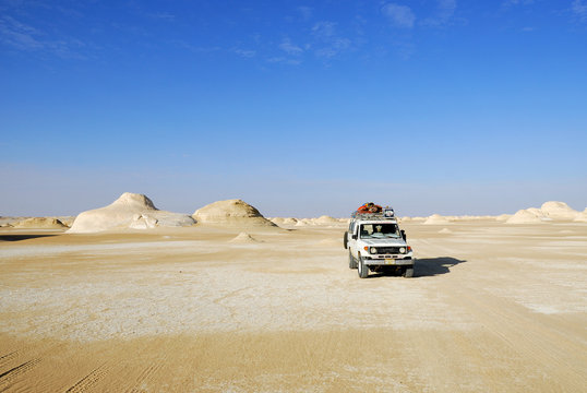 EGYPT, SAHARA - DEC 26, 2008: Off-road car Toyota Land Cruiser shown in the desert. Extreme desert safari is one of the main local tourist attraction in Egypt