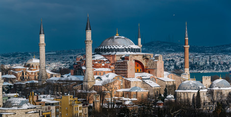 Obraz premium Snowy day in Sultanahmet Square. View of HAGIA SOPHIA. Istanbul, Turkey.Hagia Sophia (Turkish: Ayasofya), Istanbul, Turkey.