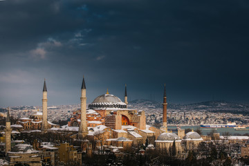 Fototapeta na wymiar Snowy day in Sultanahmet Square. View of HAGIA SOPHIA. Istanbul, Turkey.Hagia Sophia (Turkish: Ayasofya), Istanbul, Turkey.