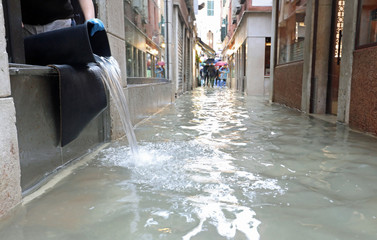 Street of Venice called CALLE in Italian language with high wate