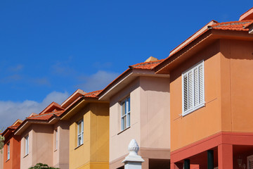 Colorful contemporary terraced houses under blue skies (Tenerife, Spain)