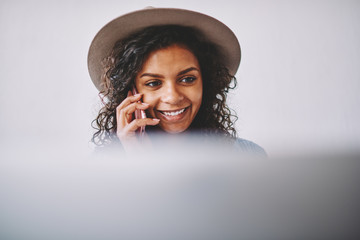 Happy emotional hipster girl feeling excited from friendly conversation via smartphone device,...