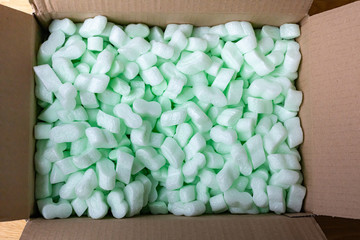 open cardboard box with styrofoam beans
