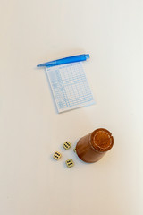 a game of yahtzee with 5 dice and a leather cup