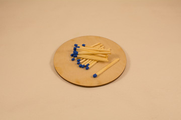 Several matches on a wooden board