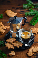 Cup of coffee with gingerbread cookie on a wooden table. Christmas or New Year composition