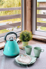 Blue iron kettle green table cup blue green breakfast basket heart window
