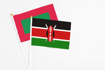 Kenya and Maldives stick flags on white background. High quality fabric, miniature national flag....