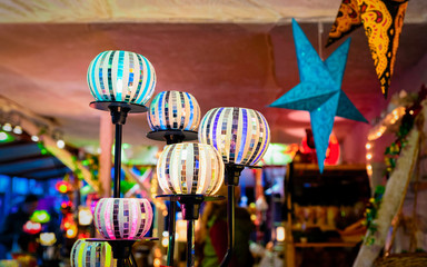 Glass lanterns as Christmas tree decorations at Christmas market in Germany in Europe in winter....