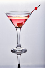 Red cocktail in isolated glass on white background