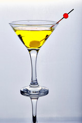 Yellow cocktail in isolated glass on white background