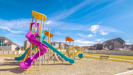 Panorama Brightly colored apparatus on a kids playground