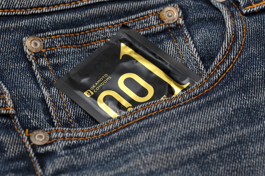BANGKOK, THAILAND -JUNE 7: Okamoto 0.01 Condom in Jean Pocket