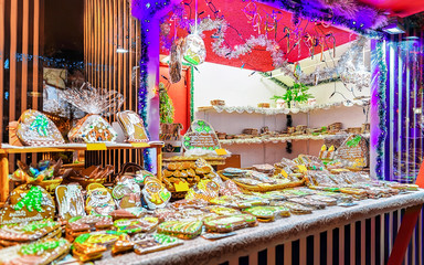 One of the most traditional sweet treats which are gingerbreads pictured in Christmas Market in Riga, Latvia. German street Xmas and holiday fair. Advent Decoration and Stalls on Bazaar