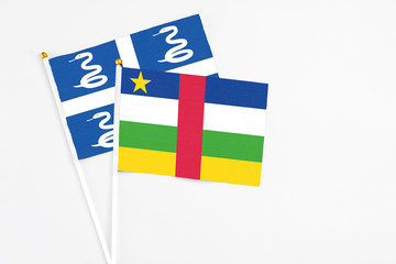 Central African Republic and Martinique stick flags on white background. High quality fabric, miniature national flag. Peaceful global concept.White floor for copy space.