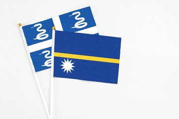 Nauru and Martinique stick flags on white background. High quality fabric, miniature national flag....
