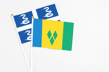 Saint Vincent And The Grenadines and Martinique stick flags on white background. High quality...