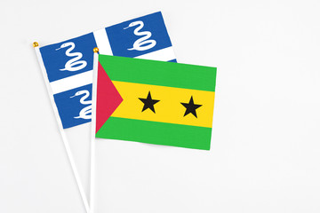 Sao Tome And Principe and Martinique stick flags on white background. High quality fabric,...