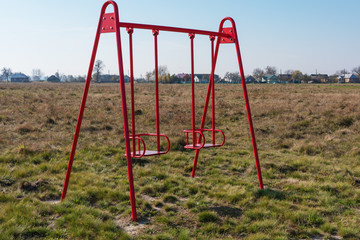 Playground in the countryside, with different types of swings and swings for children.