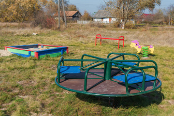 Fototapeta na wymiar Playground in the countryside, with different types of swings and swings for children.