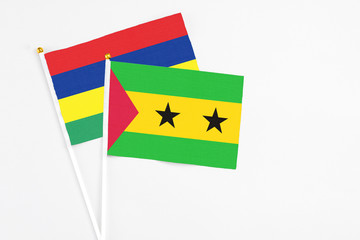 Sao Tome And Principe and Mauritius stick flags on white background. High quality fabric, miniature...