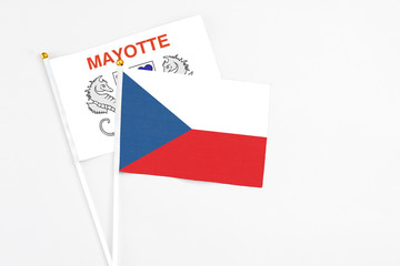 Czech Republic and Mayotte stick flags on white background. High quality fabric, miniature national flag. Peaceful global concept.White floor for copy space.