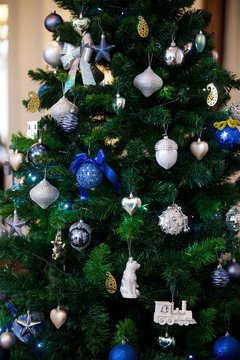 Elegant decorated with balls and figures Christmas tree