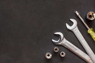 Tools for work. Wrenches, spanner on black background. Repair auto concept. Flat lay. Copy space....