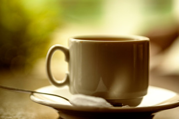 Cup of coffee in a cafe. Photographed close-up.