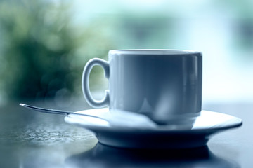 Cup of coffee in a cafe. Photographed close-up.