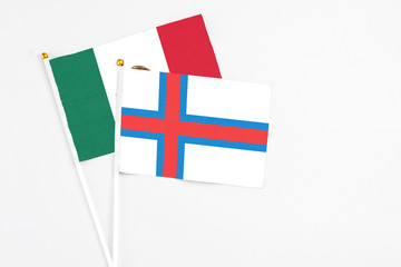 Faroe Islands and Mexico stick flags on white background. High quality fabric, miniature national flag. Peaceful global concept.White floor for copy space.