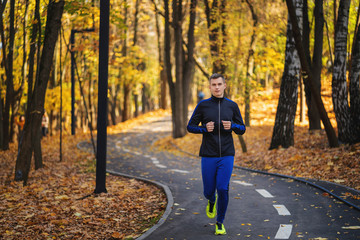 Fototapeta premium young man running in the park
