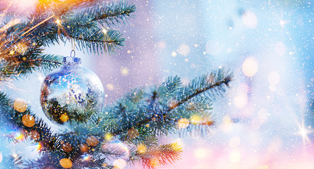 Christmas and New Year holidays background. Glitter lights backdrop. Winter season. Text space. Closeup of Christmas-tree.